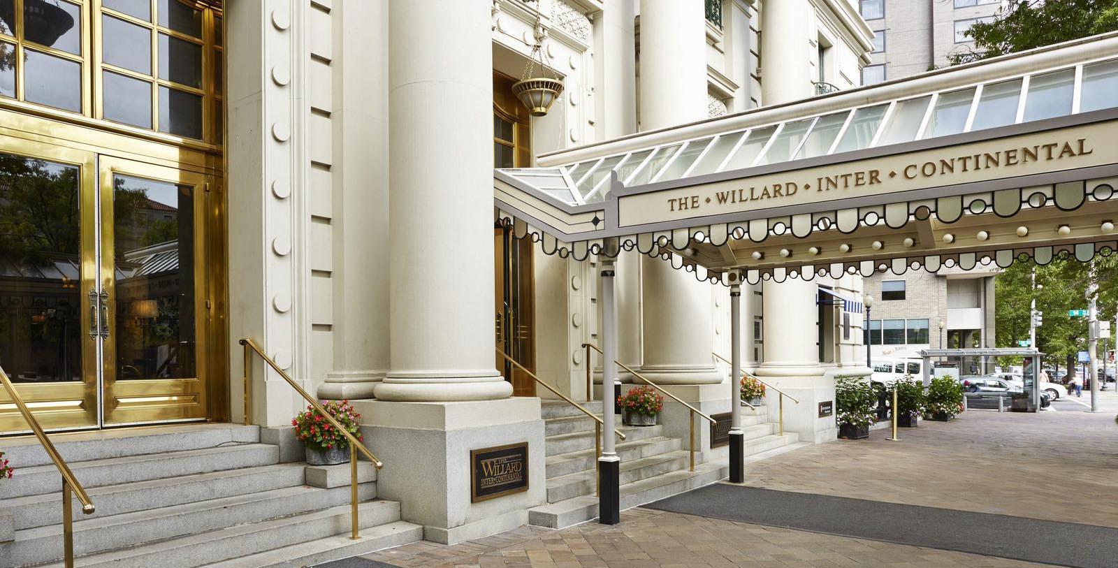 Discover the grand lobby of The Willard InterContinental, Washington DC and its coffered ceilings, Corinthian columns, rare mosaic floors, brass chandeliers, and intricate woodwork.